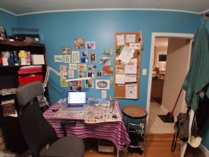 a very messy art table in a studio